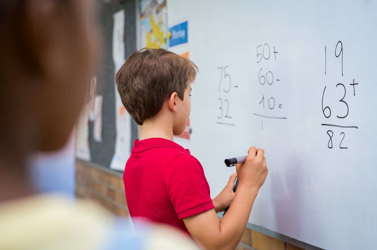 Boy Solving Math Problem